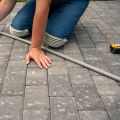 Mastering Paver Installation: Techniques for Cutting Pavers Around Curves and Corners